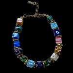 Mosaic Carnival Murano glass bracelet with colourful handcrafted glass beads and gold spacers.