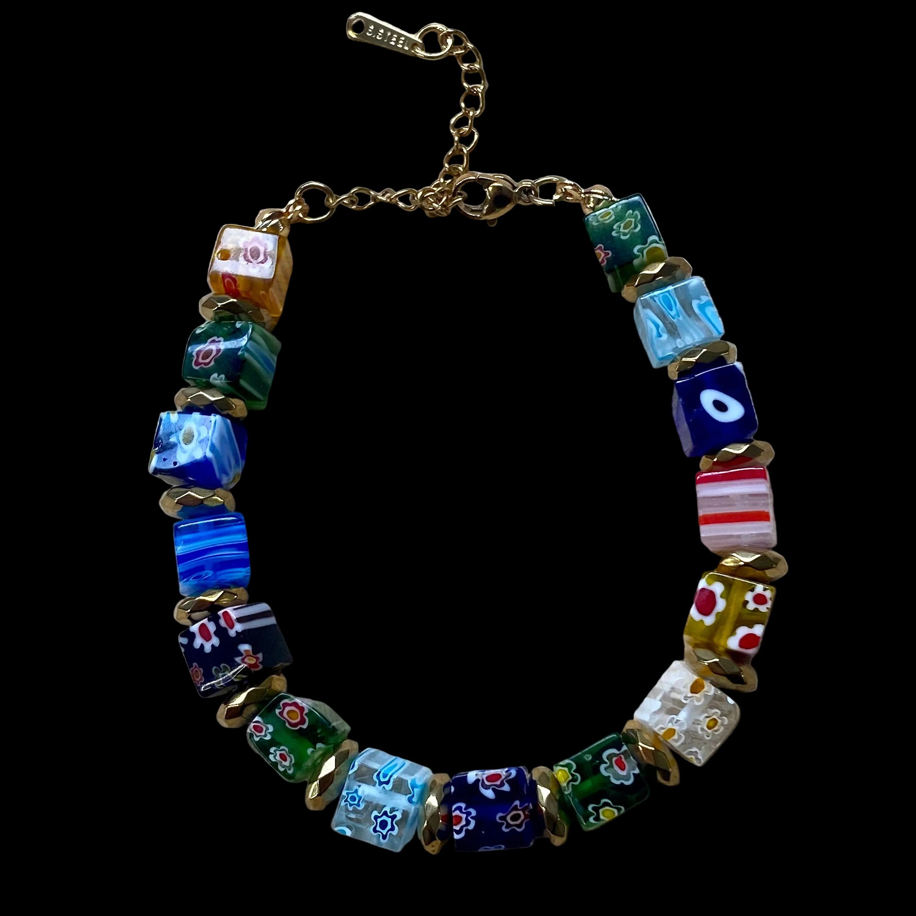 Mosaic Carnival Murano glass bracelet with colourful handcrafted glass beads and gold spacers.