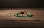 Aventurine and Hematite adjustable bracelet on a wooden surface
