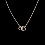 925 Sterling Silver Interlocking Hearts Necklace with two connected open heart pendants on a fine sterling silver chain.