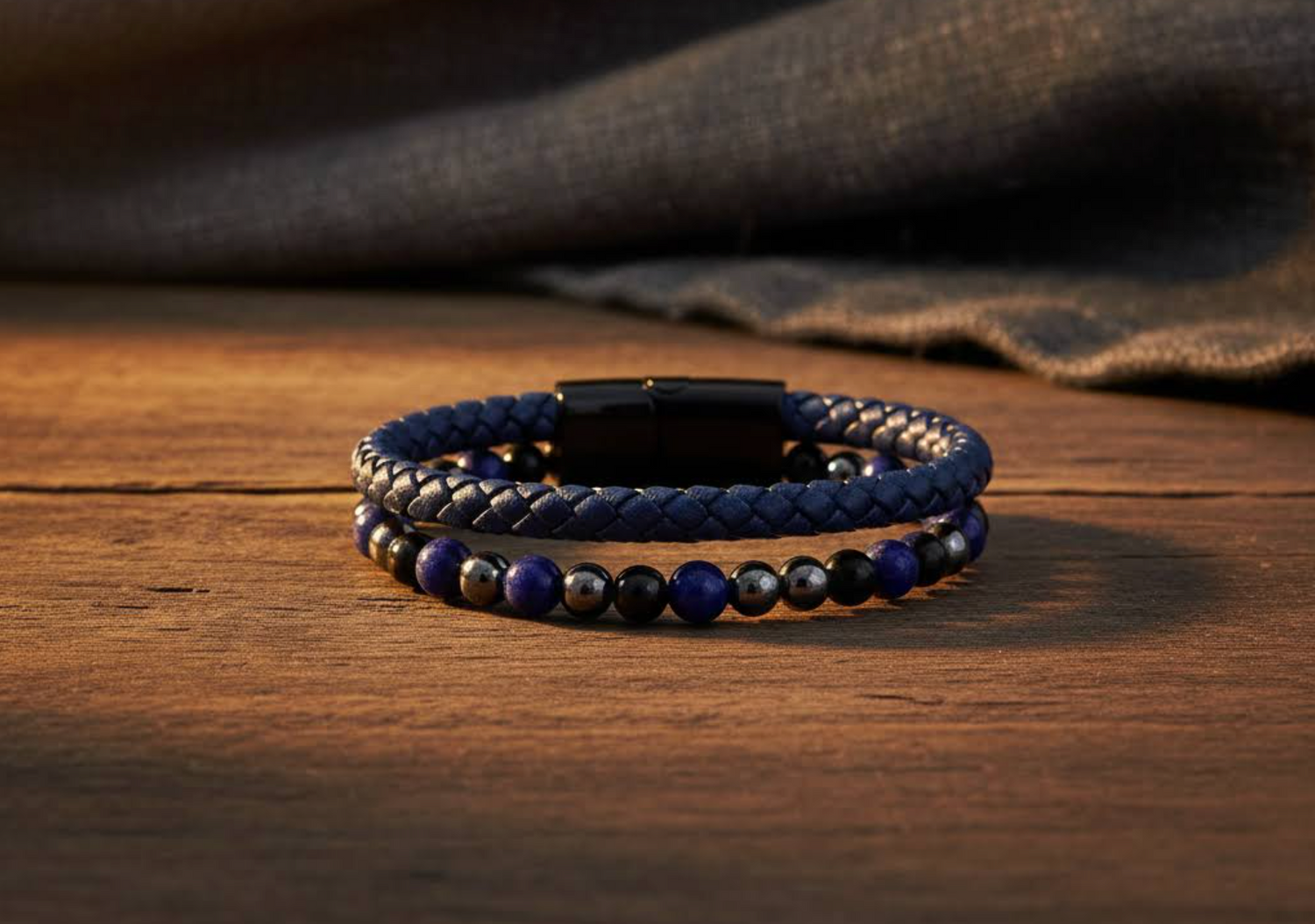 leather hematite lapis lazuli and black onyx  bracelet on a wooden surface