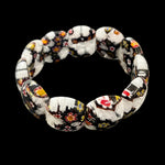 Mosaic Bracelet Verona featuring handcrafted Murano-inspired black and white glass beads with colourful Millefiori-style floral patterns and a comfortable stretch fit.