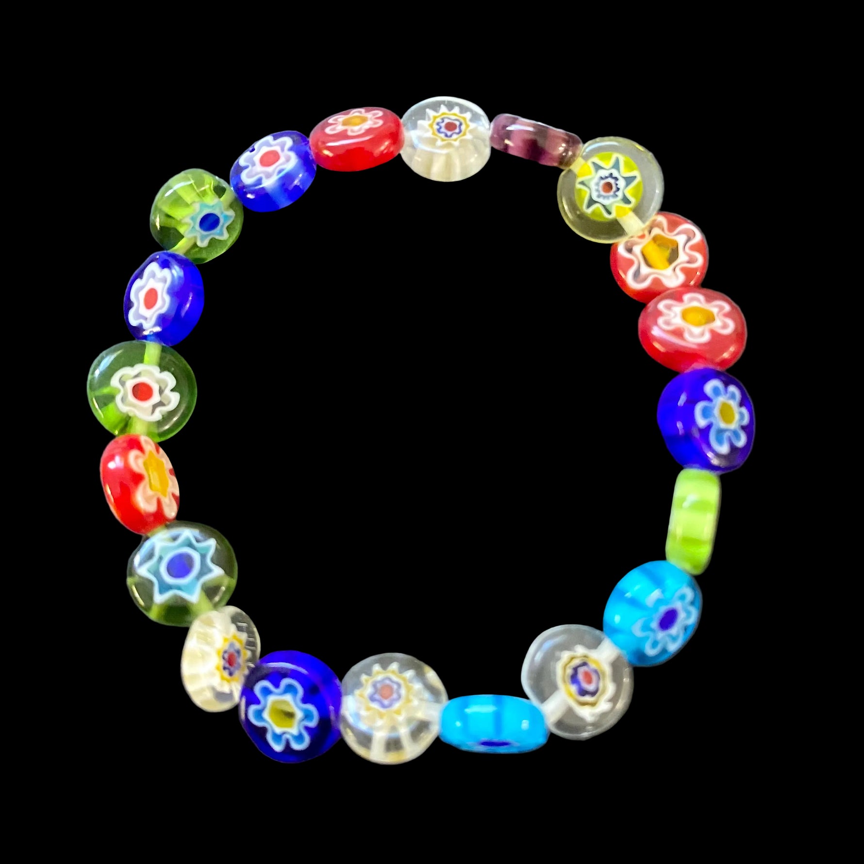 Mosaic Bracelet Positano featuring colourful round Murano-style glass beads with floral patterns on a comfortable stretch bracelet.